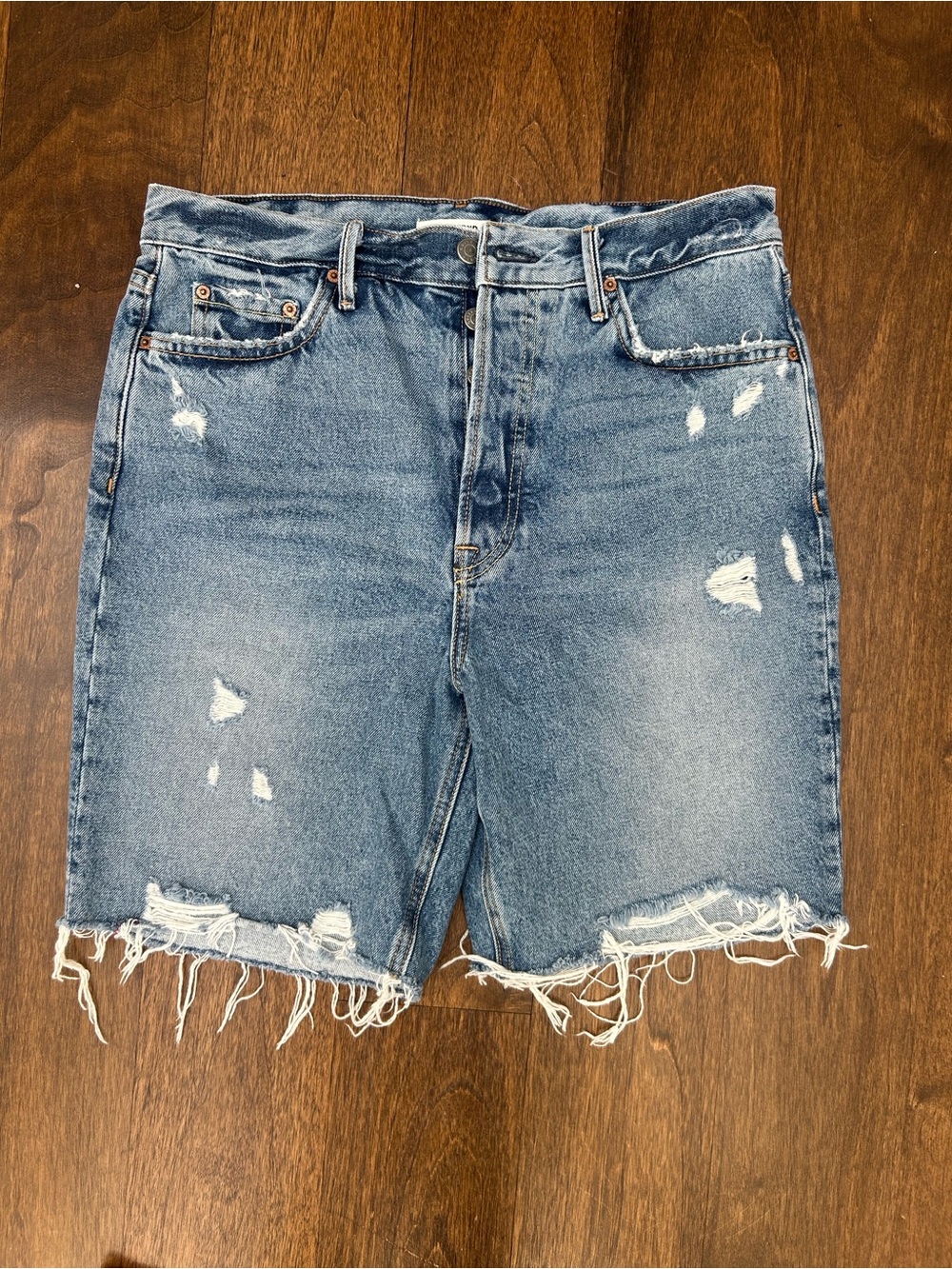 GRLFRND Distressed Frayed Hem Denim Shorts in Blue